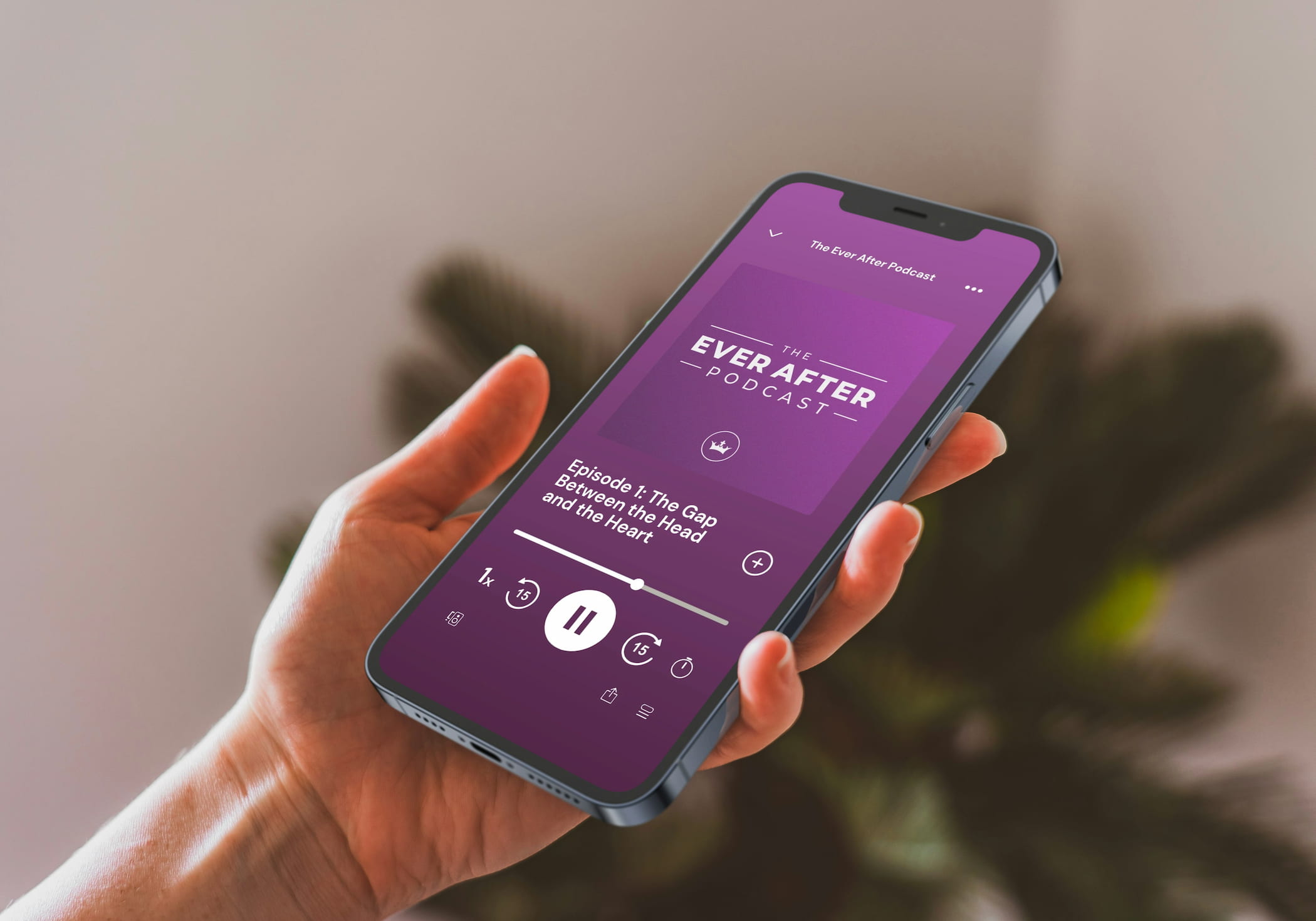 A woman's hand holding an iPhone showing Spotify playing episode 1 of the Ever After Podcast